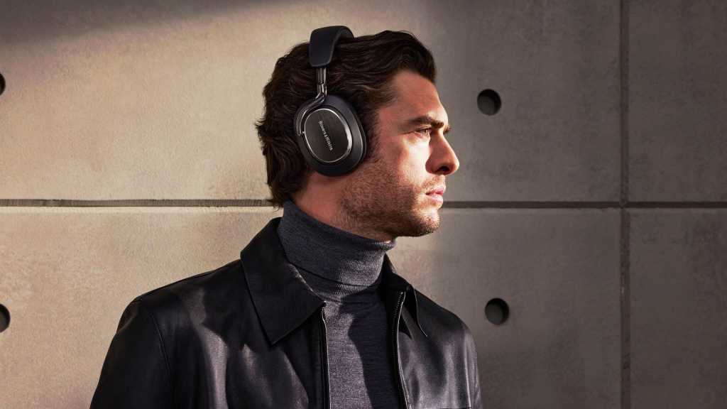 Man wearing B&W Px8 S2 headphones